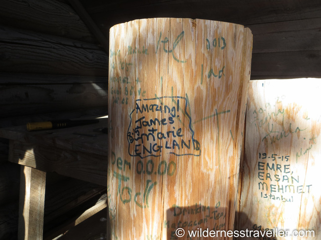 Names written on a stump of wood