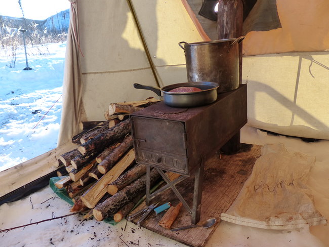 Wood burning stove in a tent